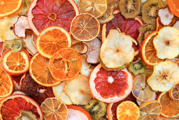 Dried fruit and citrus slices on a wooden table