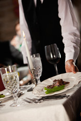 Restaurant: Server Puts Plate On Table