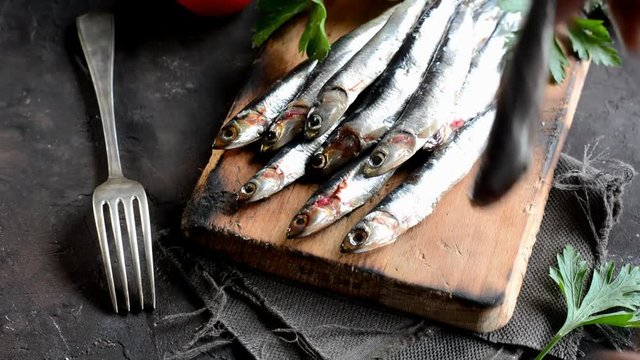 Fresh anchovies with parsley, lemon and tomato