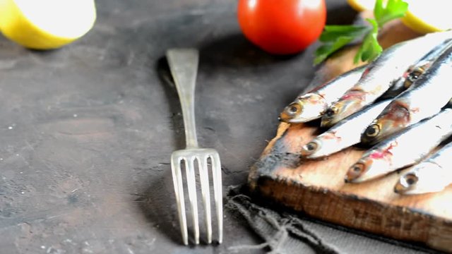 Fresh anchovies with parsley, lemon and tomato