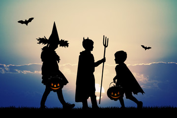 children with trick or treat for Halloween