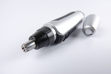 Battery powered nose hair trimmer isolated on white.