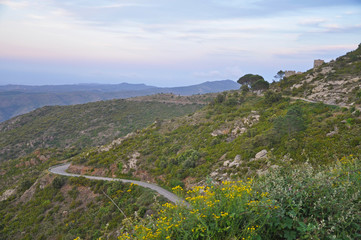 Evening landscapes of Spain - mountains, roads and medieval monastery Sant Pere de Rodes