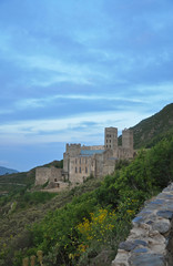 Evening landscapes of Spain - mountains, roads and medieval monastery Sant Pere de Rodes