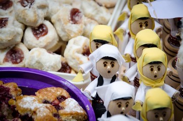 wooden dolls dressed in traditional costume for street food festival