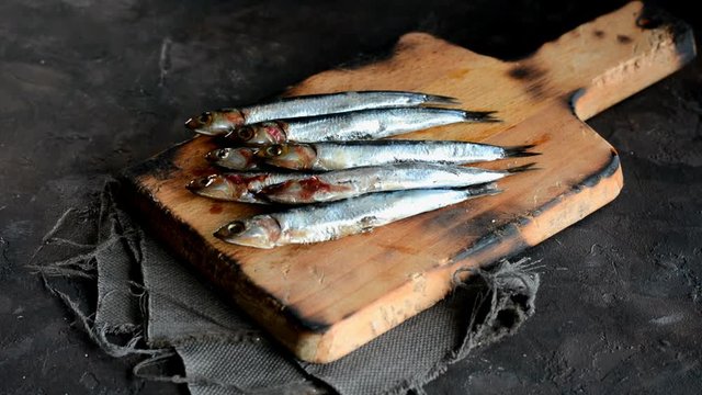 Fresh anchovies with parsley, lemon and tomato