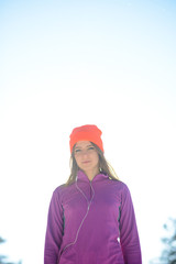 Young Woman Runner in Beautiful Winter Forest at Sunny Frosty Day. Active Lifestyle and Sport Concept.