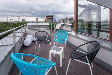 Roof terrace with modern chairs