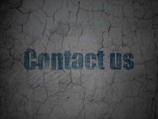 Business concept: Blue Contact us on grunge textured concrete wall background