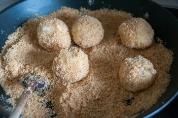 breaded apricot dumplings in pan