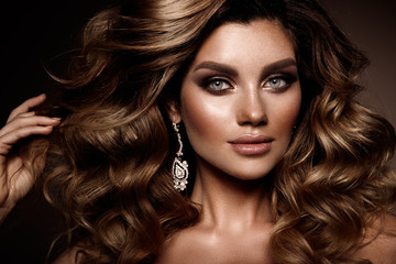 Fototapeta premium Beautiful young brunette with bright make up