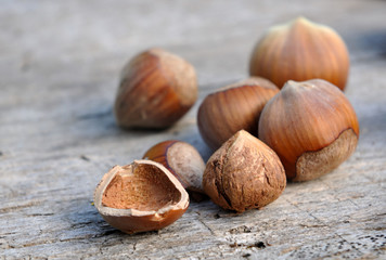 husked hazelnut on wooden background