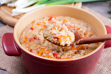 Barley porridge on a wooden spoon