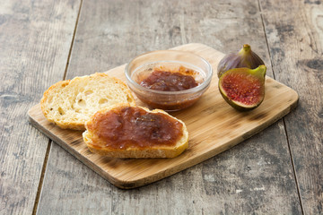Fig cookies in toast on wooden table
