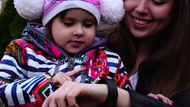 Sister play with little girl at outdoor.