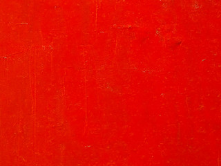 Abstract vibrant red paint texture and background.