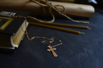 gold cross and a Bible . symbols of faith and spirituality
