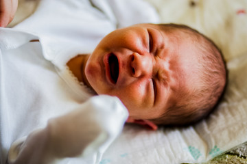 A little baby cries and screams