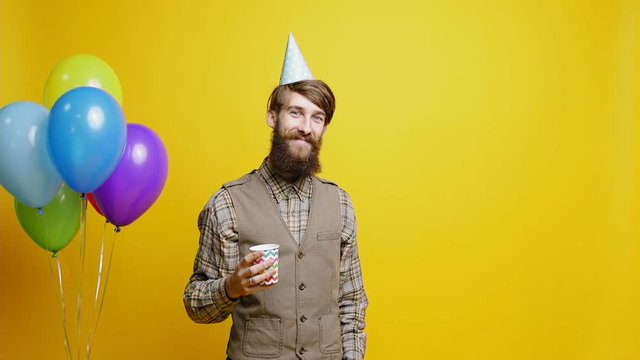 Portrait of bearded man. Confetti in party booth