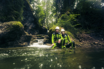Germany, Bavaria, Allgaeu, young couple canyoning in Ostertal