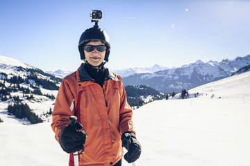 Austria, Damuels, skier with action cam in winter landscape