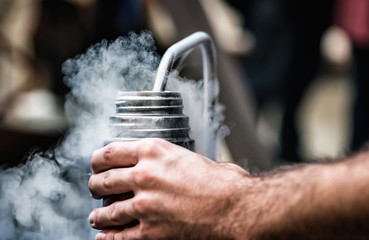 Filling the thermos with liquid nitrogen