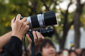 Hand with digital camera of taking photo picture