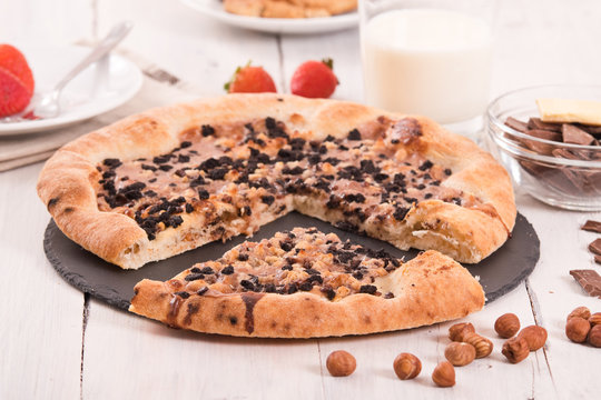 Sweet chocolate pizza with cookies.