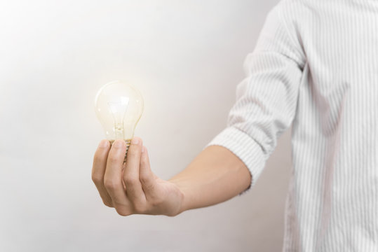 Business hand holding light bulb. concept of new ideas with innovation and creativity.