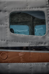 parking in the airport window of little popular   plane