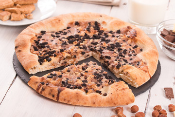 Sweet chocolate pizza with cookies.