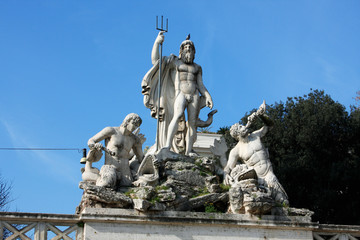 Fototapeta premium Statues on the Piazza del Popolo (People's Square) named after the church of Santa Maria del Popolo in Rome, Italy