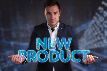 The concept of business, technology, the Internet and the network. Young businessman showing inscription: New product