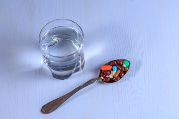 Medicines on a blue wooden background