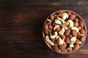 Healthy mix nuts on wooden background