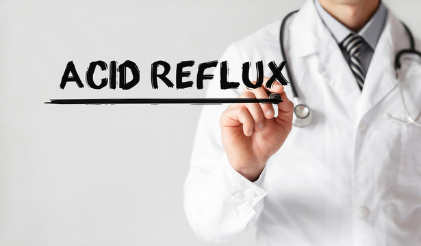 Doctor writing word Acid Reflux with marker, Medical concept