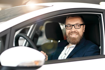 Smiling man behind the wheel