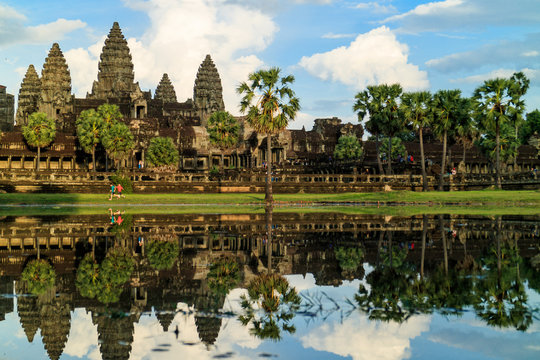 Children running in front of Angkor Wat