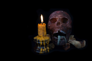 Still life of human skull and candle light,Halloween concept, Close Up skull  and candle still life style
