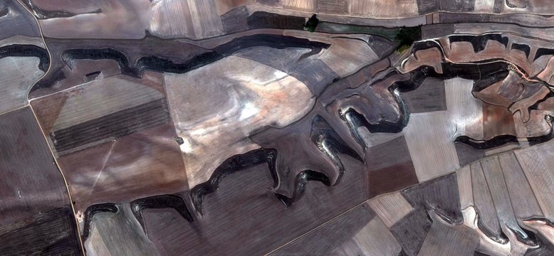 the edges of time, allegory, tribute to Picasso, abstract photography of the Spain fields from the air, aerial view, representation of human labor camps, abstract, cubism, abstract naturalism,