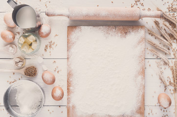 Baking ingredients on rustic white background