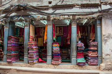 Fototapeta premium Colorful textiles, woven rugs and mats on display in open air market and store in Kathmandu, Nepal