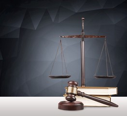 Justice Scales and books and wooden gavel on table. Justice