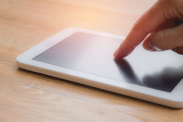 Hand of woman using smartphone or tablet, personal chat, shopping, and social media.