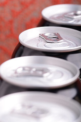 white metal beer cans background close up