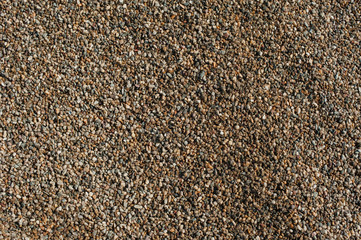 Small and big sand, gravel and pebbles background pattern