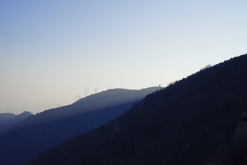 Obraz premium A view from mountains to the valley covered with smog.