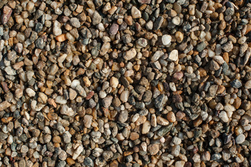 Small and big sand, gravel and pebbles background pattern