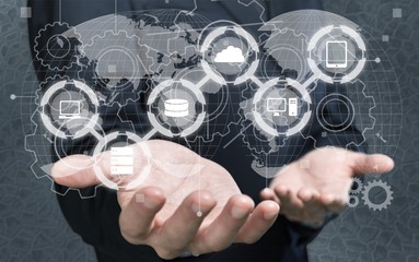 Man holding business elements icons on screen