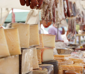 Countertop with cheeses and sausages on the market in Spain